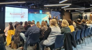 A bunch of people watching an AccessibilityOz presentation